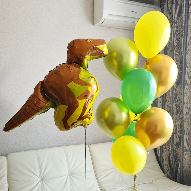 Воздушные шары желтого и золотого цвета с динозавром